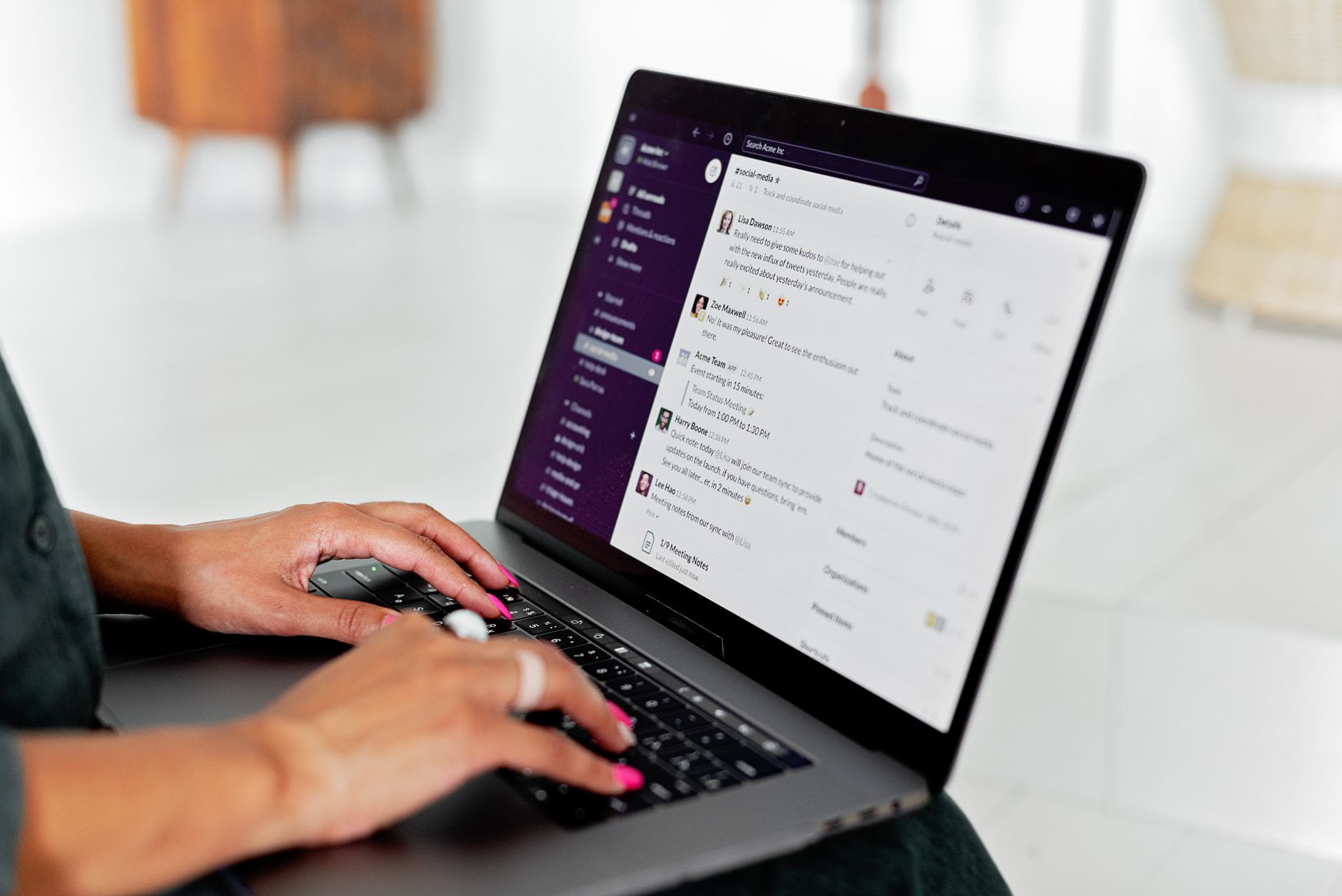 Person typing a prompt into an AI chat application on a laptop